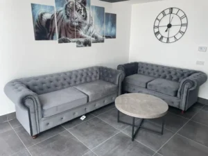 Chesterfield 3+2 seater sofa in plush velvet upholstery with tufted details, thick fibre-filled seating, and curved armrests for a luxurious touch.