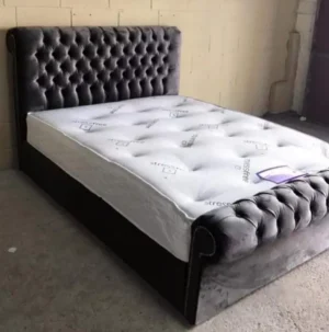 Modern sleigh bed with optional storage in grey silver, pink, blue, and black – available in the UK.